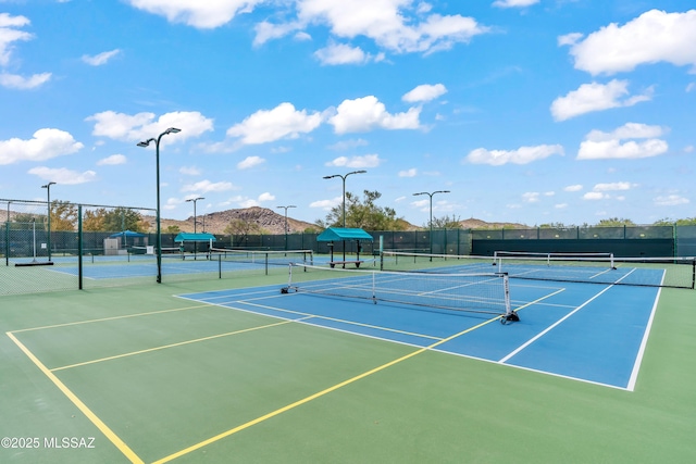 view of sport court with fence