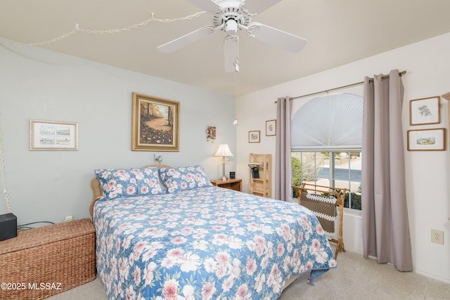 bedroom with carpet floors, access to exterior, and a ceiling fan