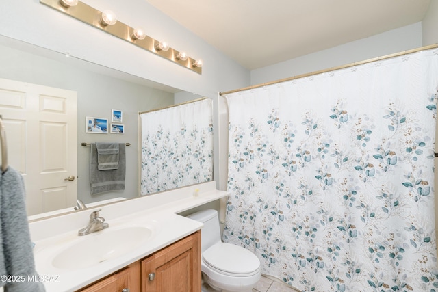 full bathroom with tile patterned flooring, a shower with shower curtain, vanity, and toilet