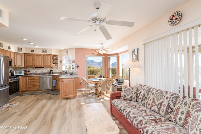 838 E Desert Glen Dr, Oro Valley, AZ 85755 - living room featuring light wood-style floors and ceiling fan