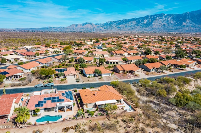 drone / aerial view featuring a residential view and a mountain view