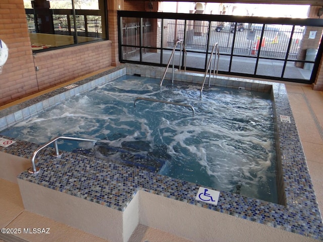 view of pool featuring an indoor in ground hot tub