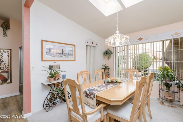 838 E Desert Glen Dr, Oro Valley, AZ 85755 - dining space featuring a skylight, lofted ceiling, a chandelier, baseboards, and carpet floors