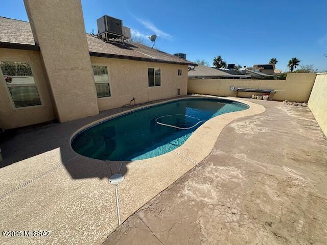 view of pool featuring central AC, a patio, a fenced backyard, and a fenced in pool