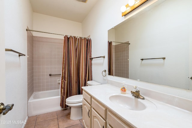 bathroom featuring toilet, vanity, shower / tub combo with curtain, and tile patterned floors