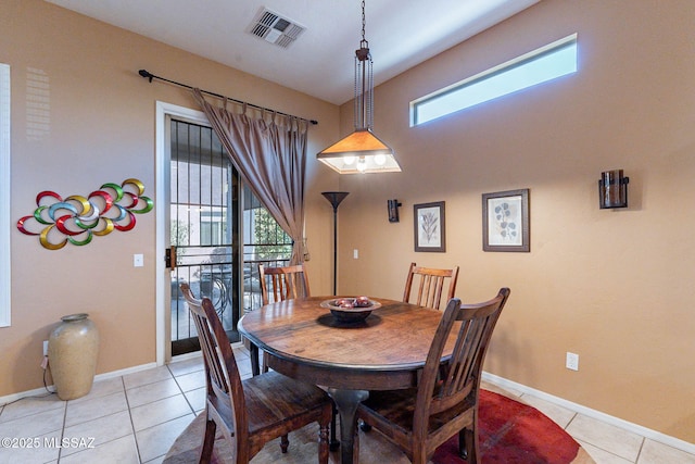 dining space with visible vents, plenty of natural light, baseboards, and light tile patterned floors