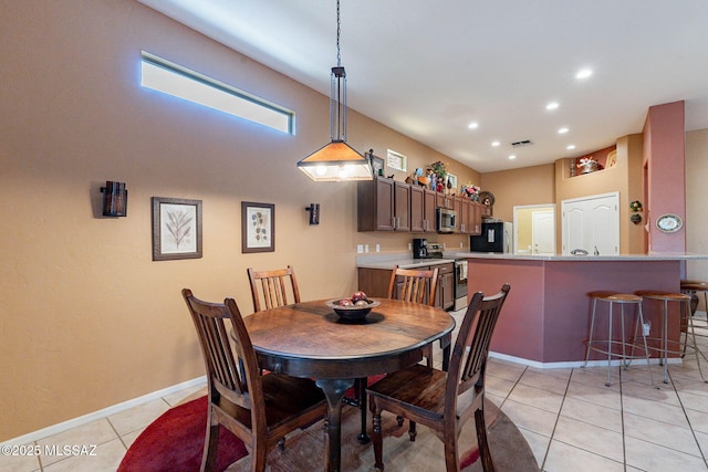 dining area featuring recessed lighting, visible vents, baseboards, and light tile patterned flooring