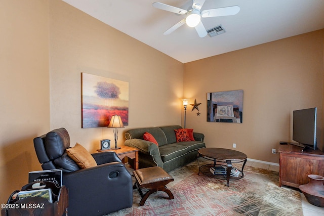 living room featuring ceiling fan, visible vents, and baseboards