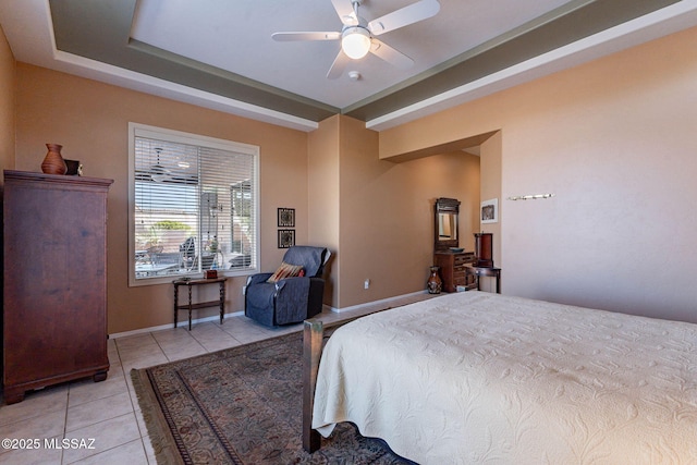 bedroom featuring light tile patterned floors, ceiling fan, and baseboards