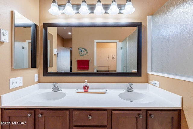 full bathroom featuring double vanity and a sink