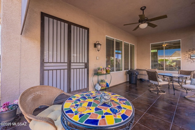 view of patio / terrace with outdoor dining space and ceiling fan