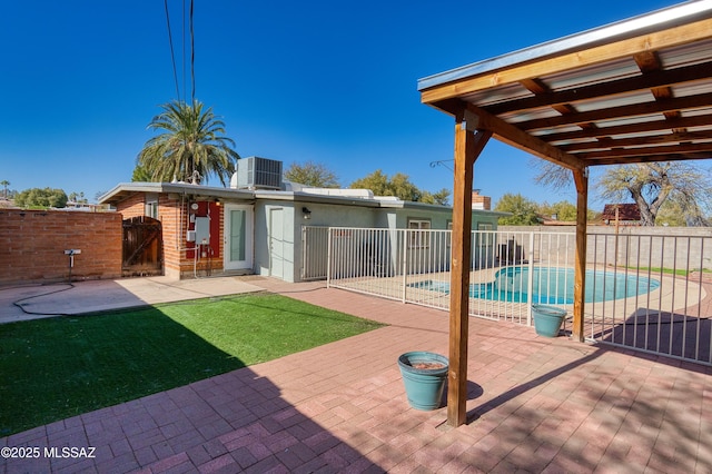 view of patio / terrace with a gate, a fenced in pool, fence, and cooling unit