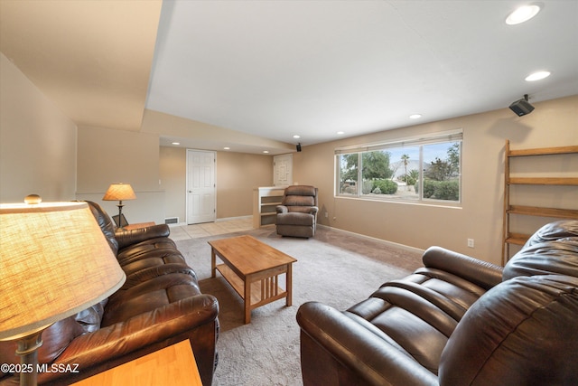 living area with visible vents, recessed lighting, baseboards, light colored carpet, and vaulted ceiling