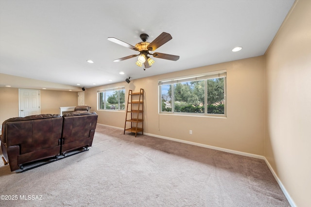 living area featuring recessed lighting, a ceiling fan, carpet, and baseboards