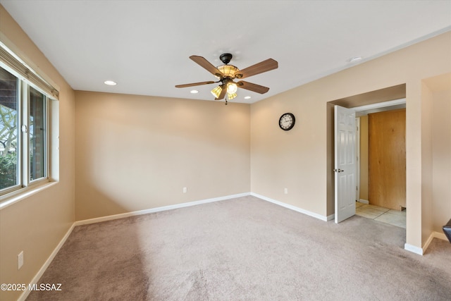 empty room with carpet flooring, recessed lighting, baseboards, and ceiling fan