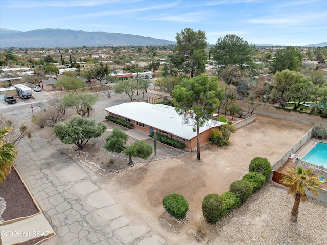 birds eye view of property featuring a mountain view