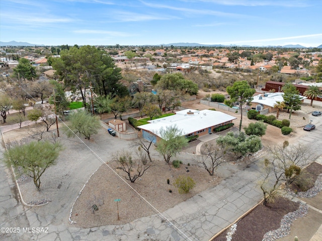 birds eye view of property featuring a mountain view