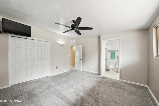 unfurnished bedroom featuring a closet, baseboards, visible vents, and carpet floors