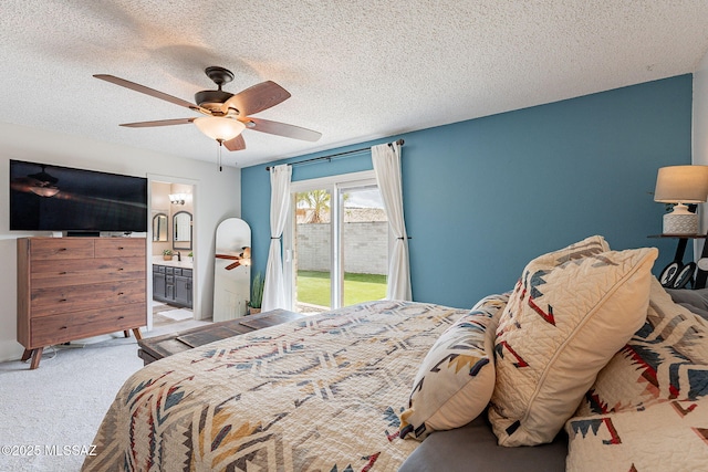 bedroom with a textured ceiling, light carpet, a ceiling fan, access to outside, and ensuite bath