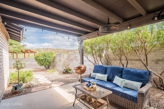 view of patio featuring ceiling fan, a fenced backyard, and outdoor lounge area