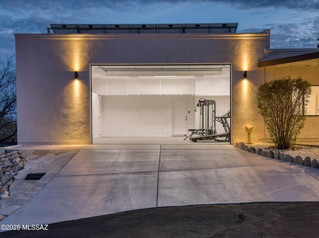 garage with concrete driveway