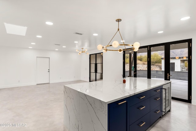 kitchen featuring an inviting chandelier, recessed lighting, finished concrete flooring, and visible vents