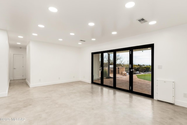 unfurnished room with visible vents, recessed lighting, finished concrete flooring, and baseboards