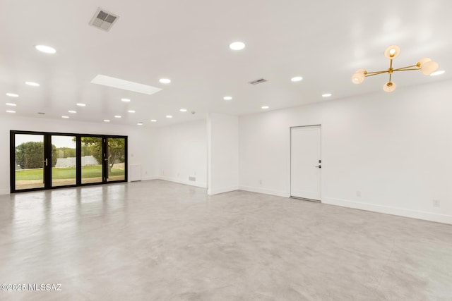 empty room featuring recessed lighting, visible vents, baseboards, and finished concrete floors