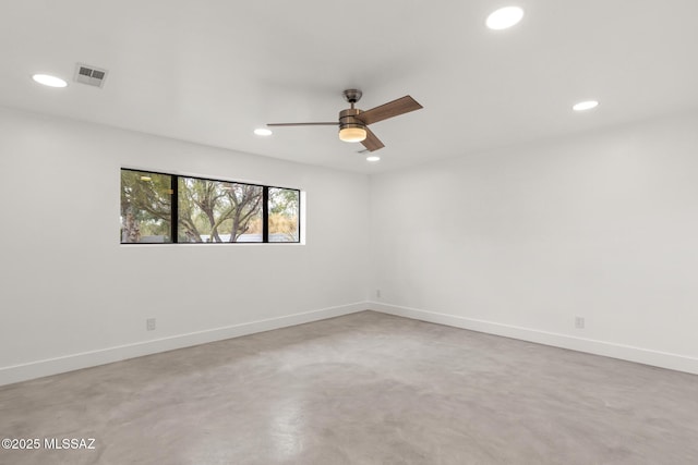 empty room featuring a ceiling fan, visible vents, baseboards, recessed lighting, and concrete flooring