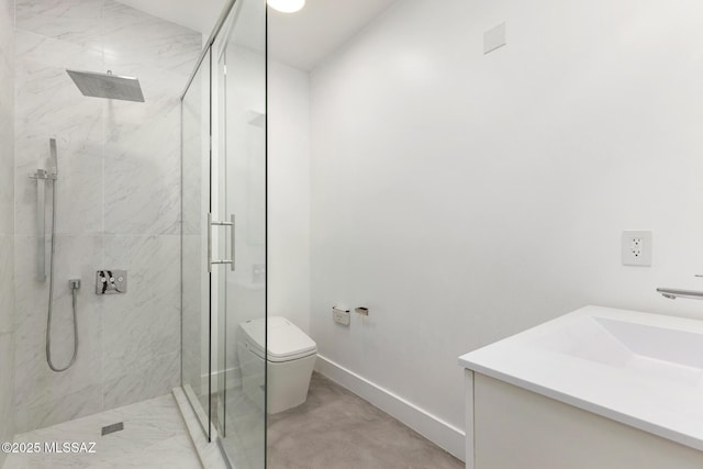 bathroom with a marble finish shower, baseboards, toilet, and vanity