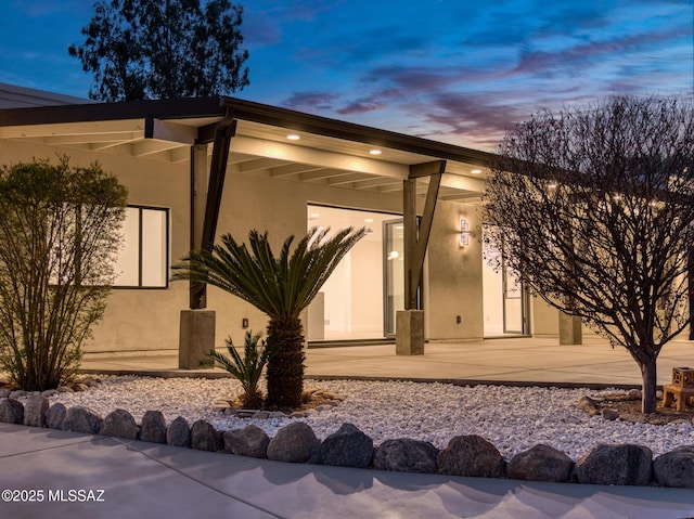 exterior space with stucco siding