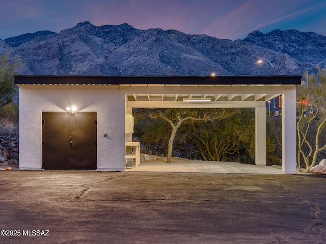 exterior space featuring a mountain view and an outbuilding