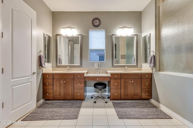 full bathroom featuring tile patterned flooring, vanity, and baseboards