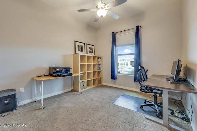 home office with a ceiling fan, carpet flooring, and baseboards