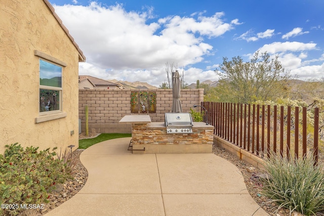 view of patio with a fenced backyard, grilling area, and area for grilling