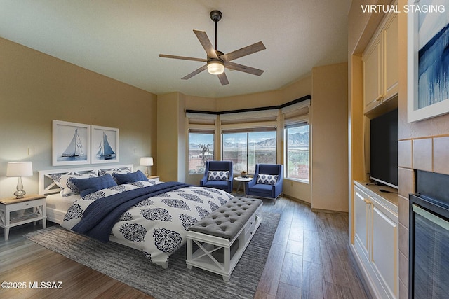 bedroom featuring dark wood finished floors