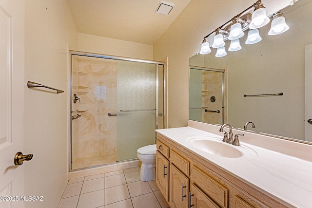 full bathroom with a stall shower, tile patterned flooring, vanity, and toilet