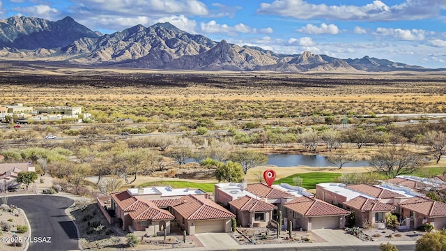 bird's eye view featuring a residential view and a water and mountain view