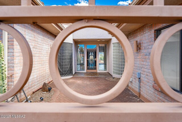 property entrance with brick siding