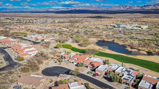 bird's eye view with view of golf course, a residential view, and a water and mountain view