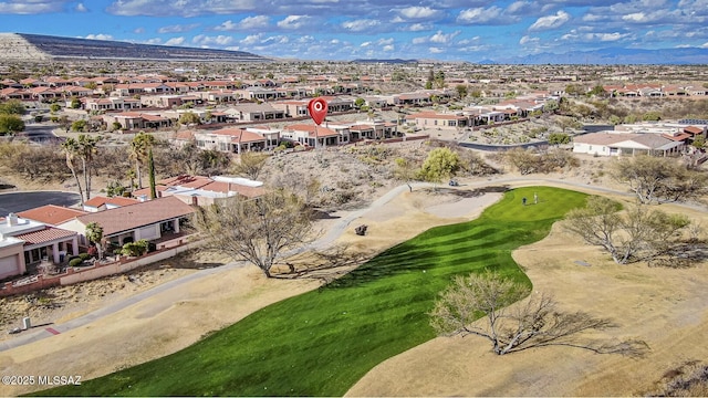 bird's eye view featuring view of golf course, a residential view, and a mountain view