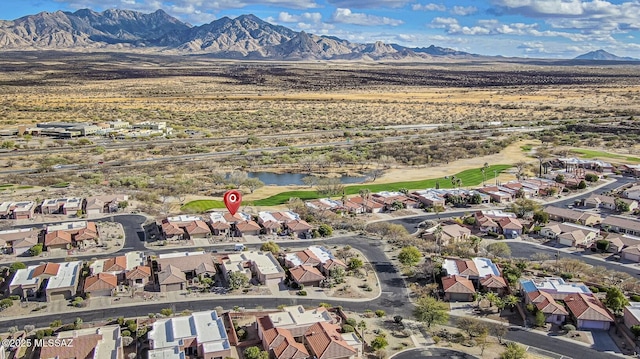 aerial view featuring a water and mountain view and a residential view