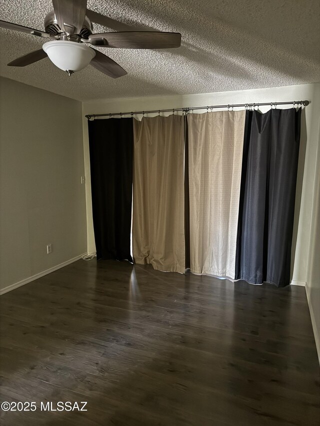 1117 E Irene St, Pearce, AZ 85625 - empty room featuring dark wood-style floors, a textured ceiling, a ceiling fan, and baseboards