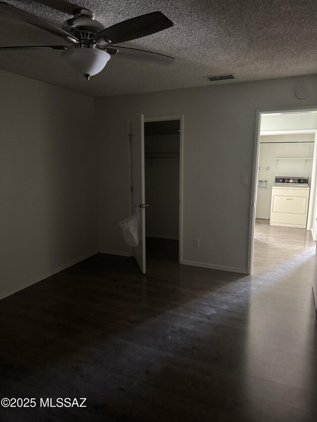 1117 E Irene St, Pearce, AZ 85625 - unfurnished bedroom featuring visible vents, ceiling fan, wood finished floors, a textured ceiling, and separate washer and dryer