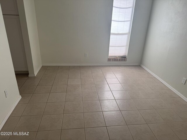 1117 E Irene St, Pearce, AZ 85625 - unfurnished room featuring baseboards and light tile patterned floors