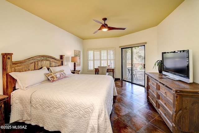 bedroom featuring dark tile patterned floors, access to outside, and ceiling fan