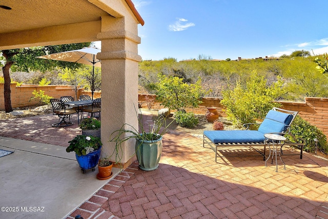 view of patio / terrace with outdoor dining space and a fenced backyard