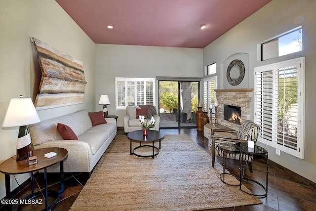 living room with a fireplace and recessed lighting