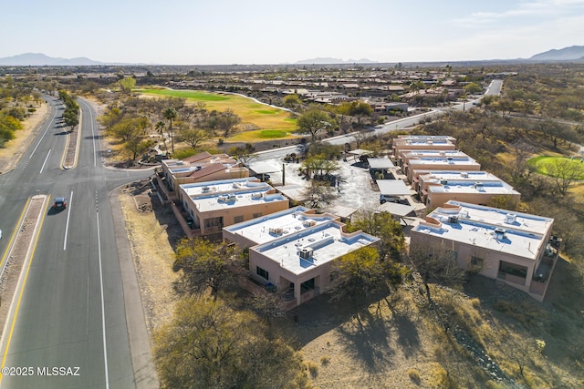 birds eye view of property with a mountain view