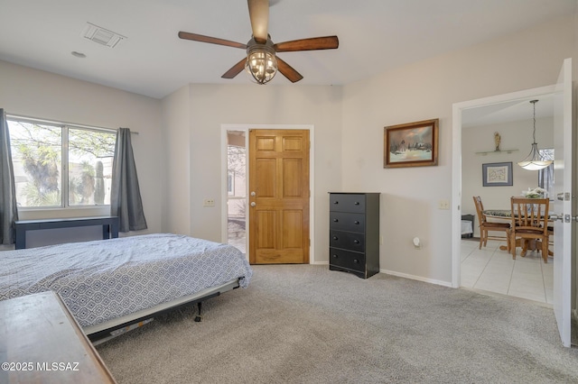 bedroom featuring ceiling fan, carpet flooring, visible vents, and baseboards